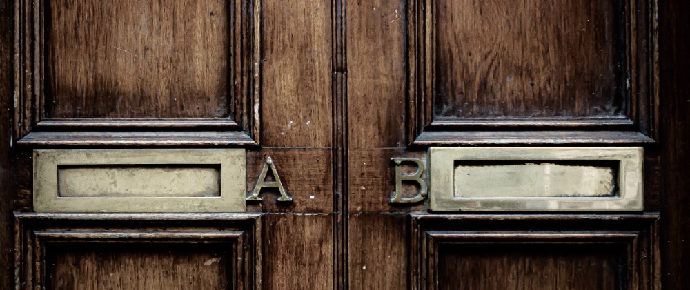 A and B letterboxes on a door