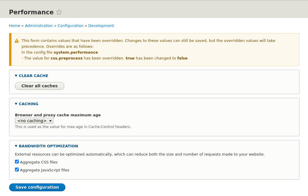 Drupal configuration override warn, showing the performance tab being overridden.