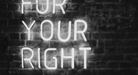 A neon sign saying 'fight for your right'