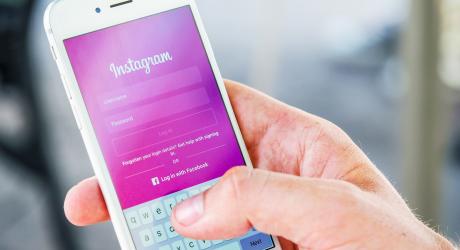 A person logging into Instagram on their smartphone