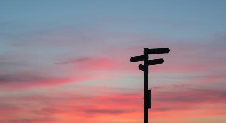 Sign posts pointing in opposite directions