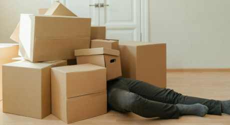 A man buried in cardboard boxes