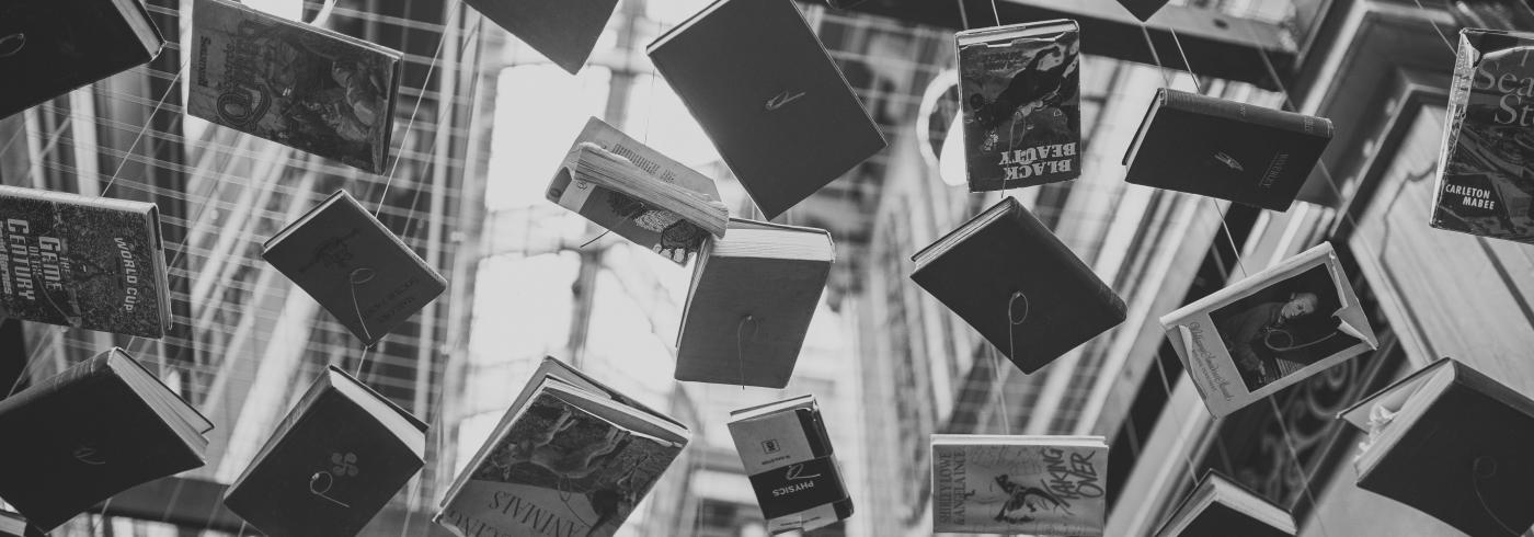 Black and white books suspended in the air