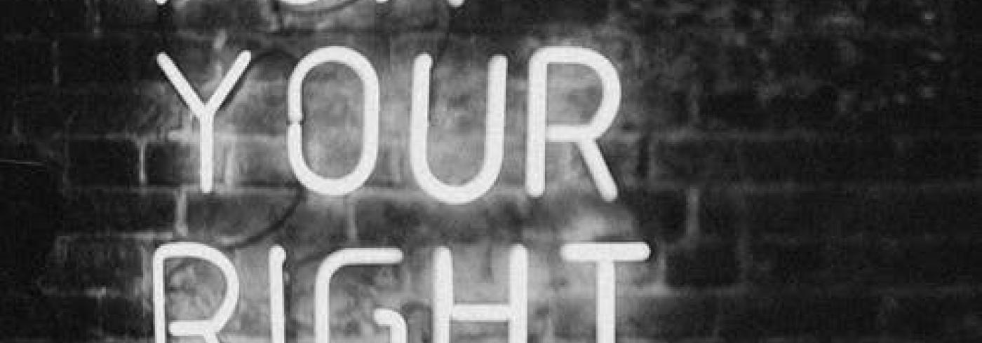 A neon sign saying 'fight for your right'