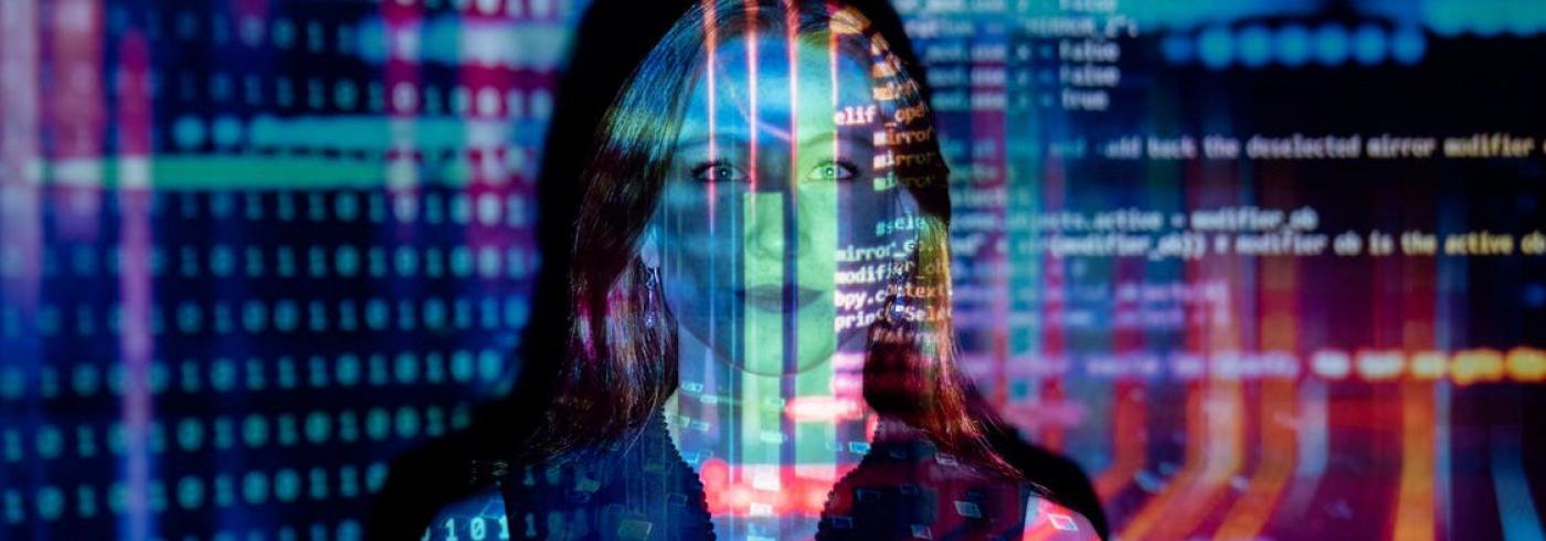 Woman with code being projected onto her face