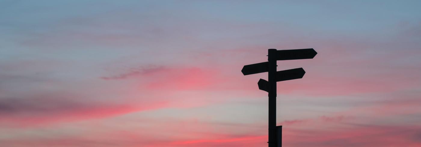 Sign posts pointing in opposite directions