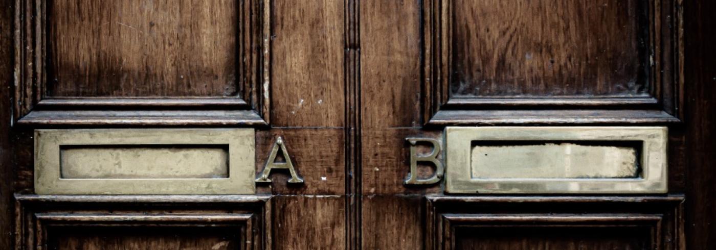 A and B letterboxes on a door