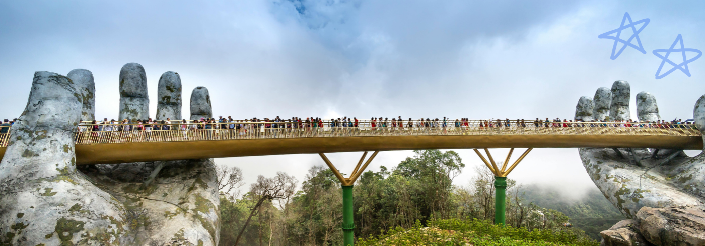 A bridge held up by huge stone hands