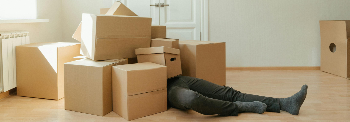 A man buried in cardboard boxes