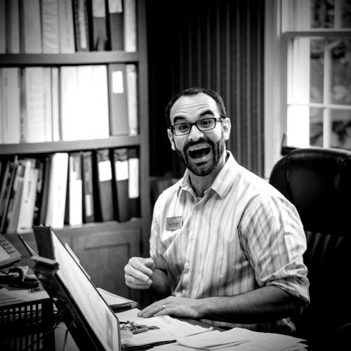 A happy man at his desk